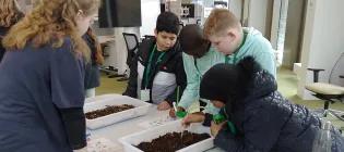 Primary school children participating in a science workshop