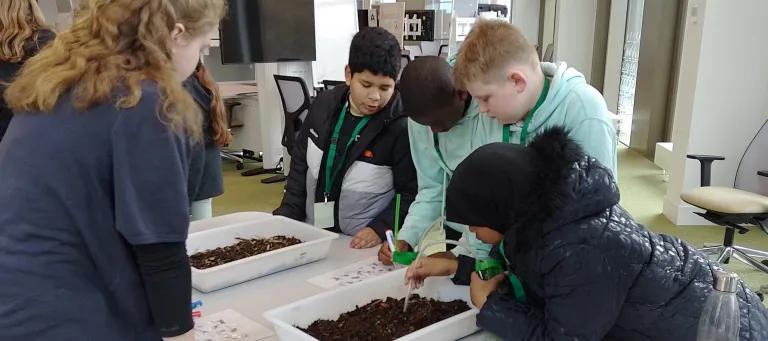 Primary school children participating in a science workshop