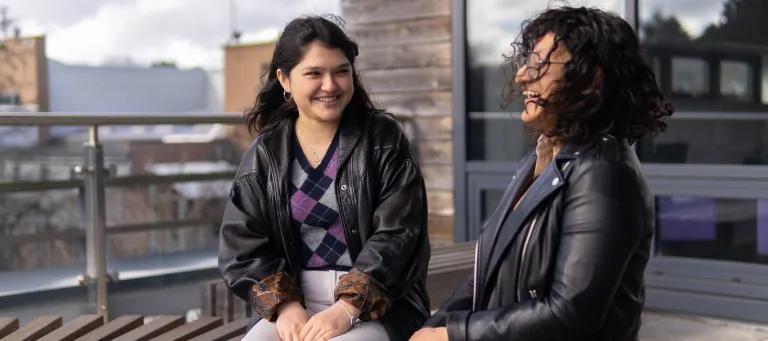 Female students on a bench talking