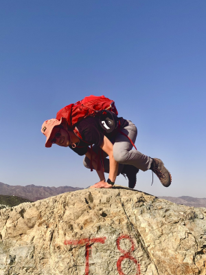 Torin practising yoga on fieldwork