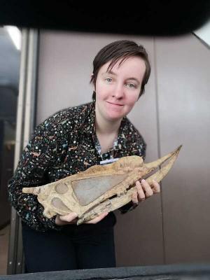 Natalia with a pterosaur's fossil